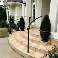 Simple curved wrought iron step railings