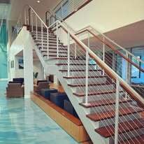 Custom steel stair with stainless steel cable railings