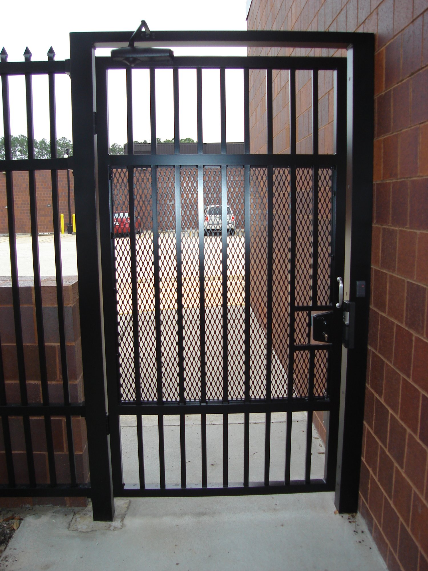 Commercial aluminum security gate with mesh and lock
