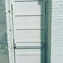 Solid aluminum privacy gate with panic hardware