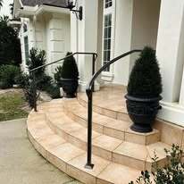 Simple curved wrought iron step railings
