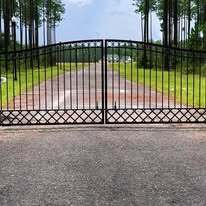 Aluminum driveway gates with double royal arch top and decorative kickplate
