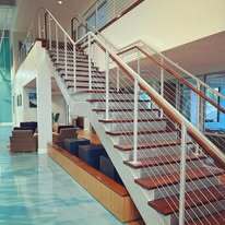 Custom steel stair with stainless steel cable railings