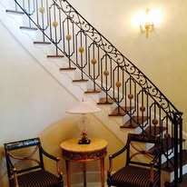 wrought iron railing with bronze medallions