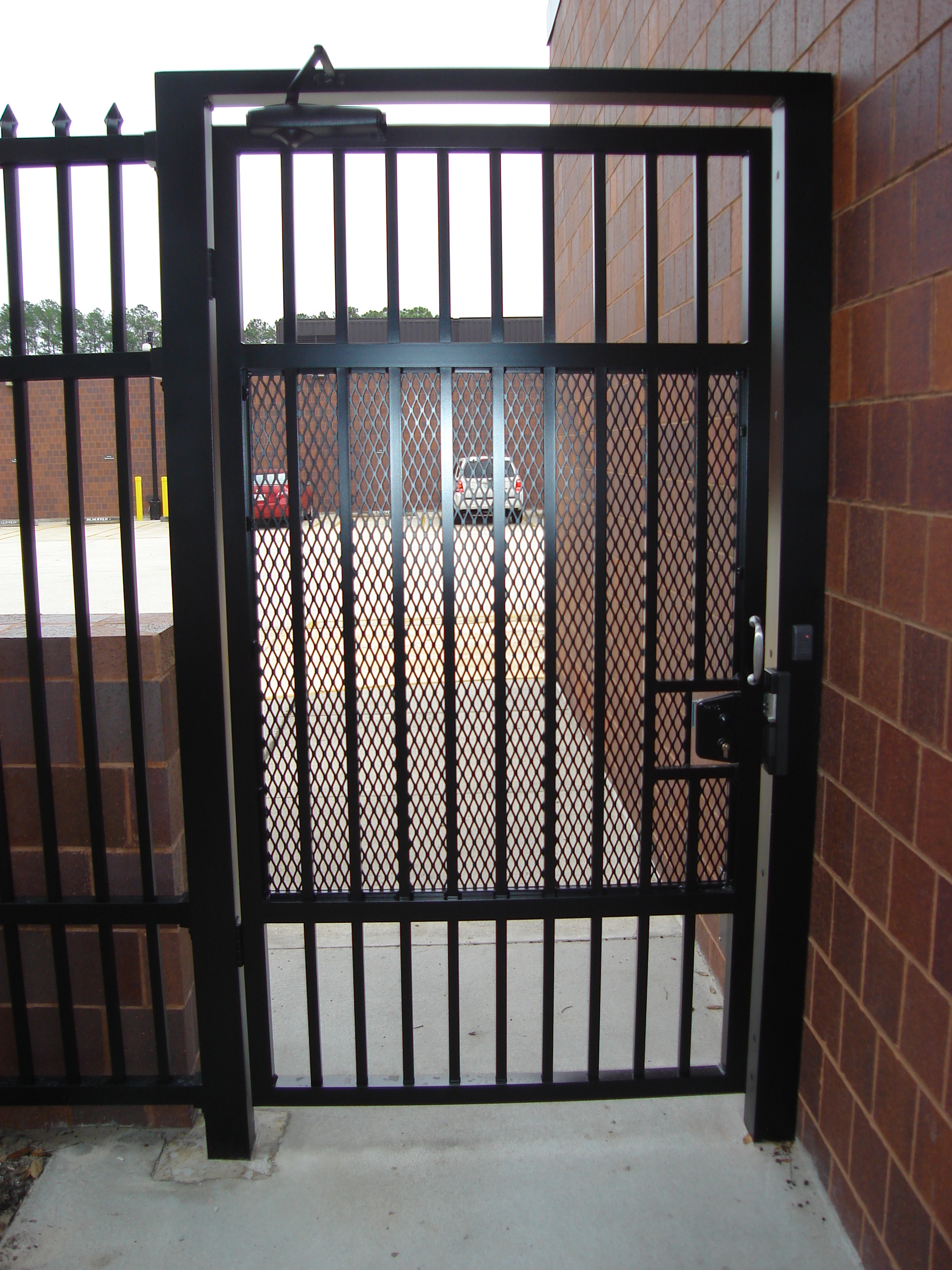 Commercial aluminum security gate with mesh and lock